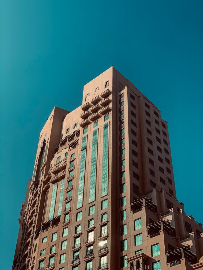 A striking modern residential building with clear blue sky in Dubai, UAE.